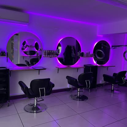 FLHAIR salon interior with purple lighting